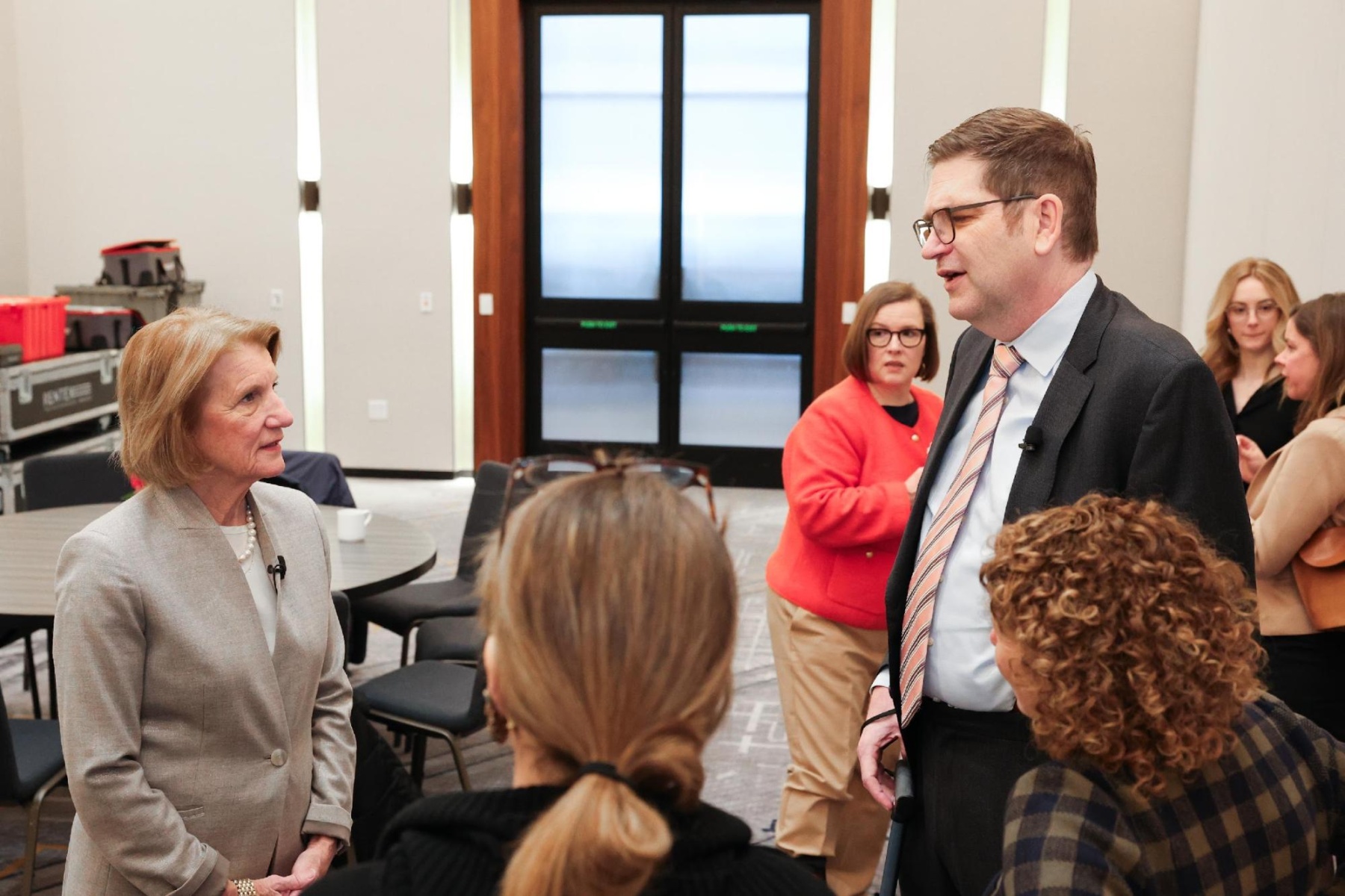 Sen Shelley Moore Capito and Russ Paulsen, President of UsAgainstAlzheimer's, chat backstage about medical research funding